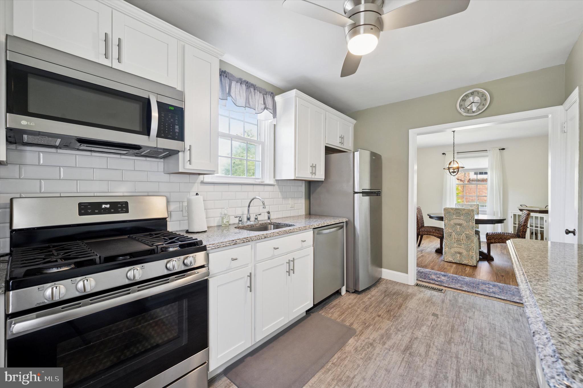 313 Edgemore Road Secane, PA 19018 - Photo 7 of 22 a kitchen with stainless steel appliances a stove microwave and refrigerator