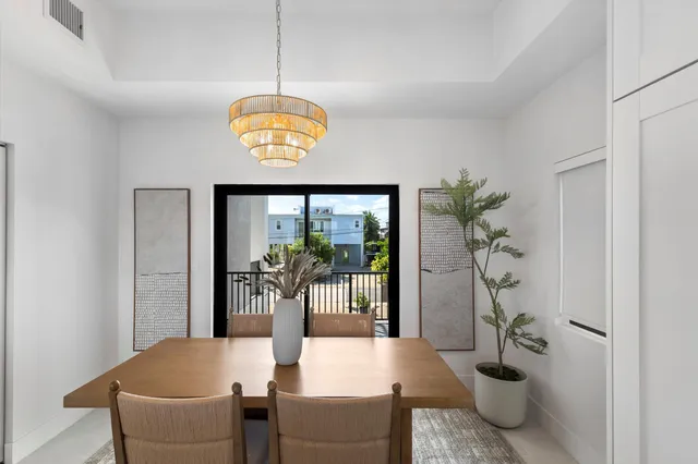 a large kitchen with a table and chairs