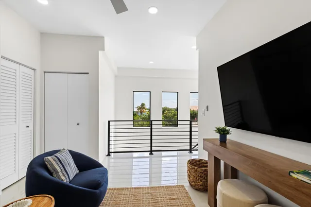 a bedroom with a bed and a mirror