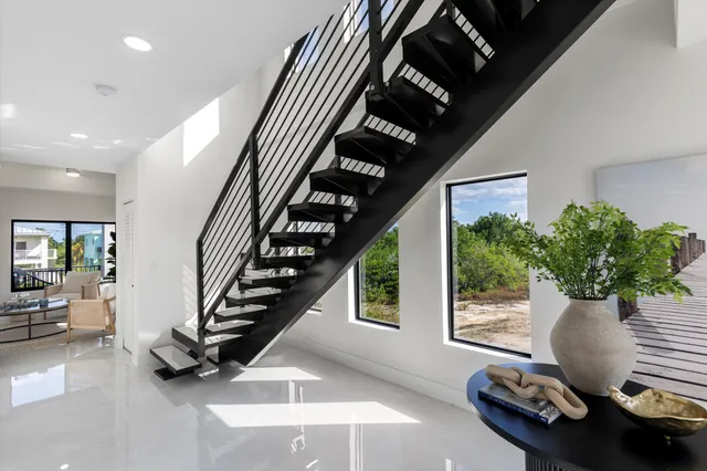 a bedroom with a bed and a potted plant