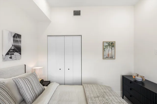 a bathroom with a shower and a glass door