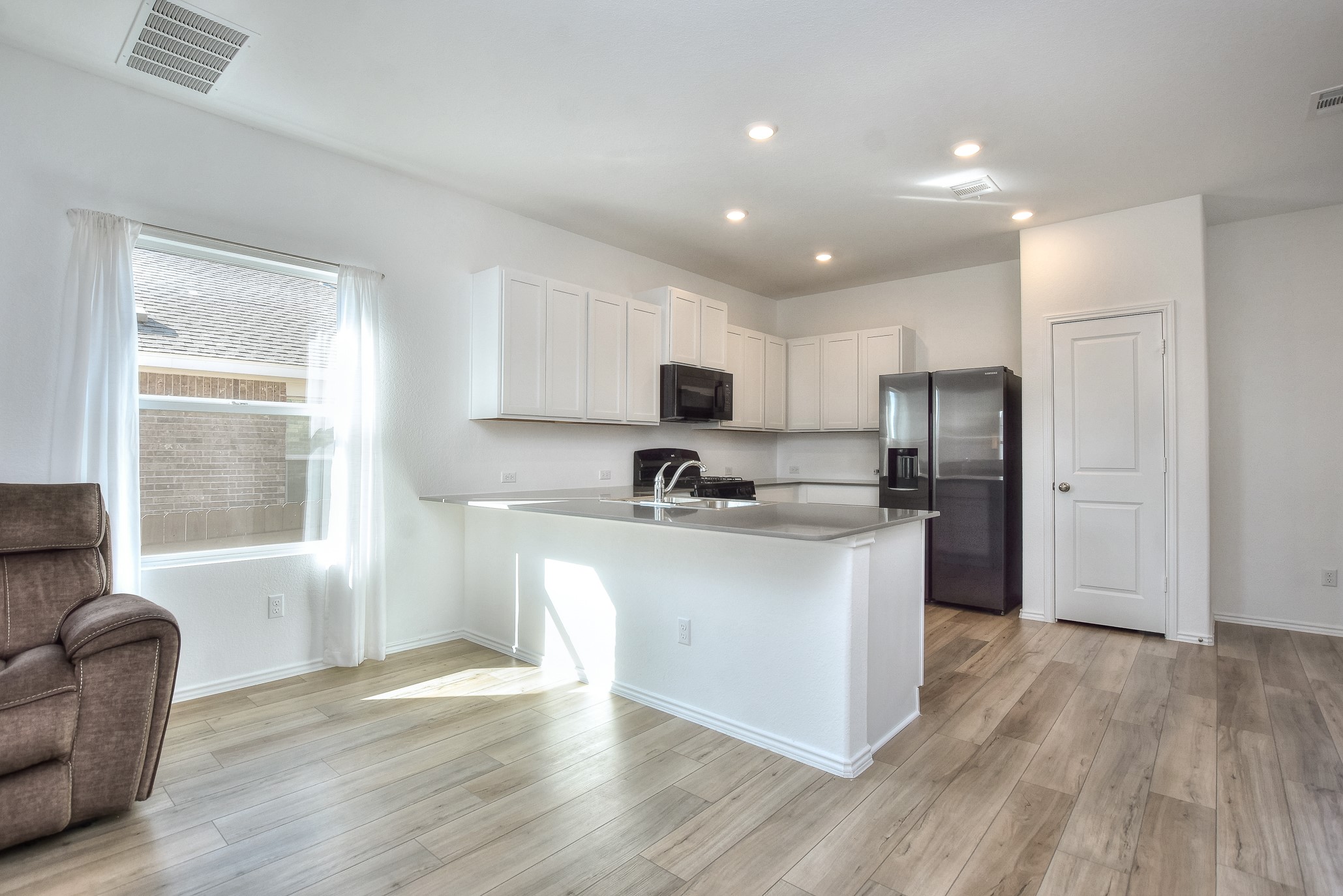 2221 Four Waters Loop Georgetown, TX 78628 - Photo 10 of 40 Family Room/Breakfast Bar