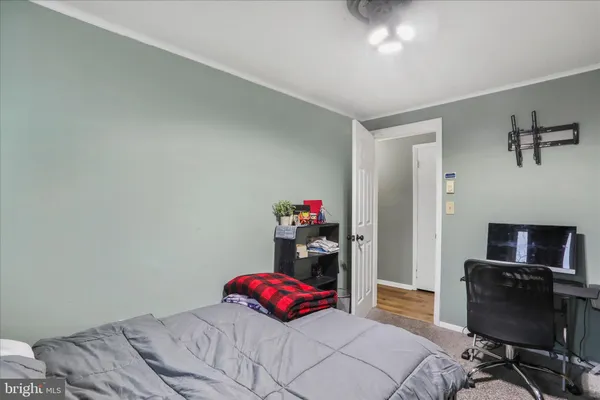 a bedroom with a bed and a chair