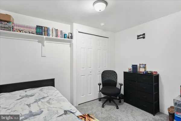 a workspace with furniture and a book shelf