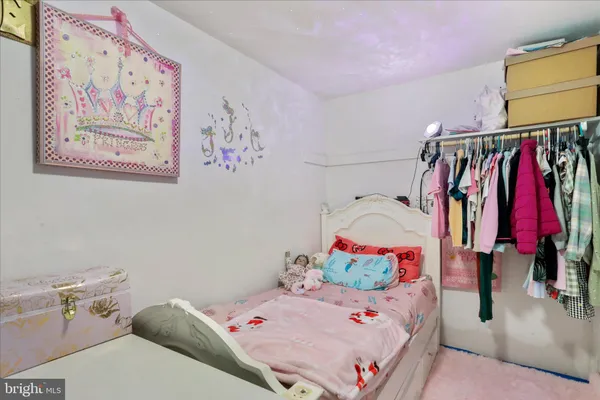 a bedroom with a bed and a closet