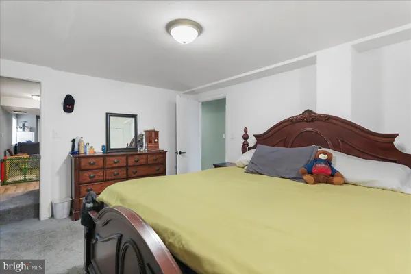 a bedroom with a bed and a closet