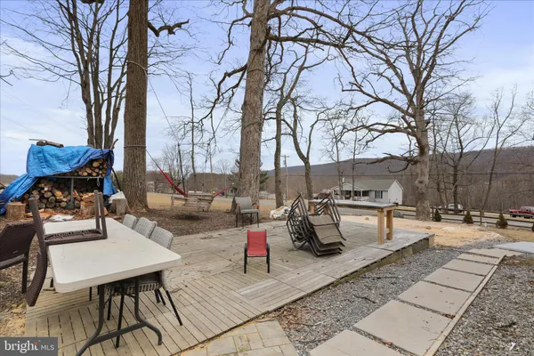 a view of a backyard of the house