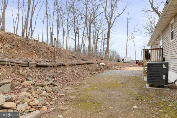 a view of a chairs and table in backyard