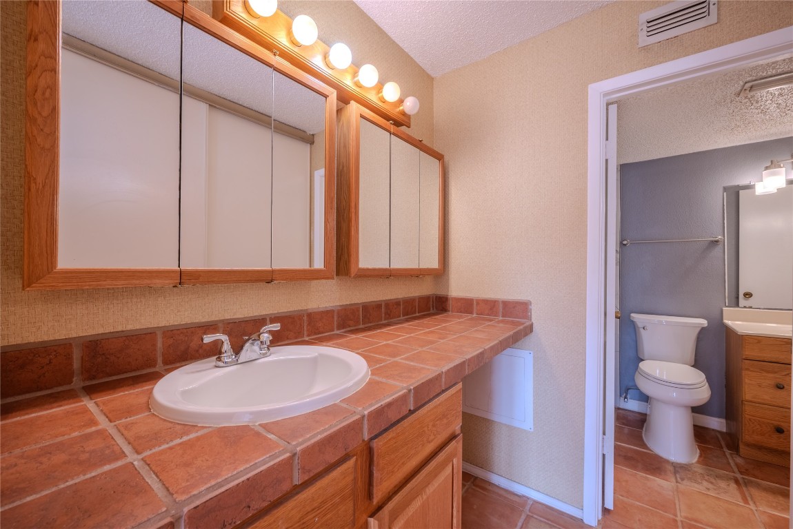13034 Leader Street, Unit 960 Houston, TX 77072 - Photo 11 of 28 a bathroom with a sink and a mirror