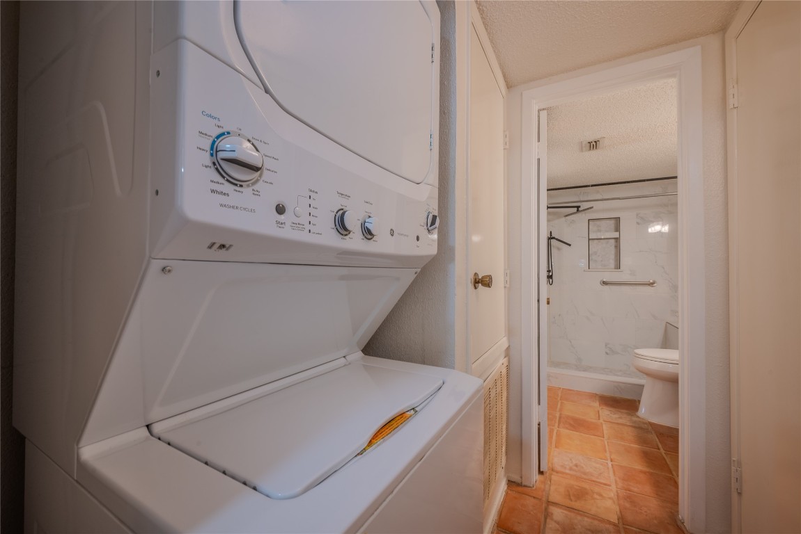 13034 Leader Street, Unit 960 Houston, TX 77072 - Photo 14 of 28 a bathroom with a toilet and a shower