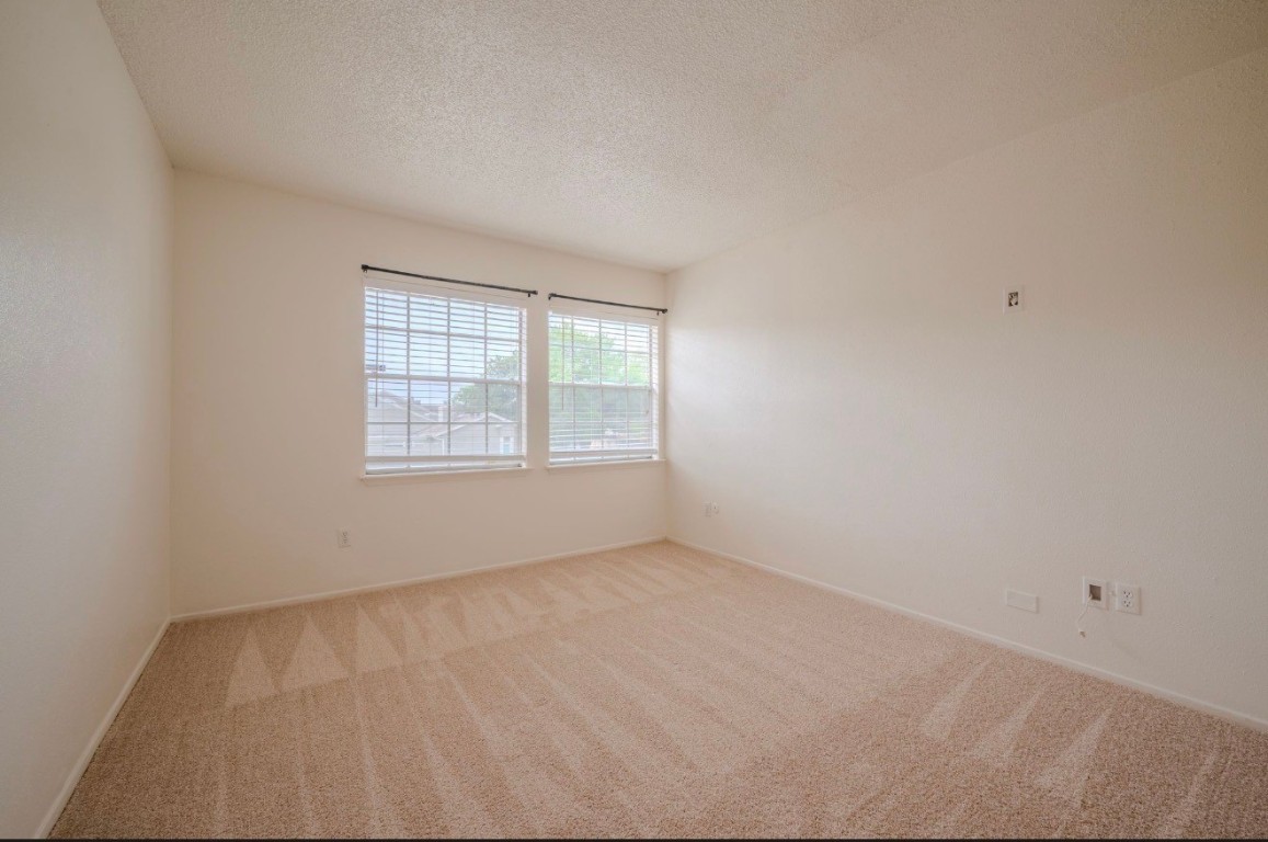13034 Leader Street, Unit 960 Houston, TX 77072 - Photo 23 of 28 an empty room with a window