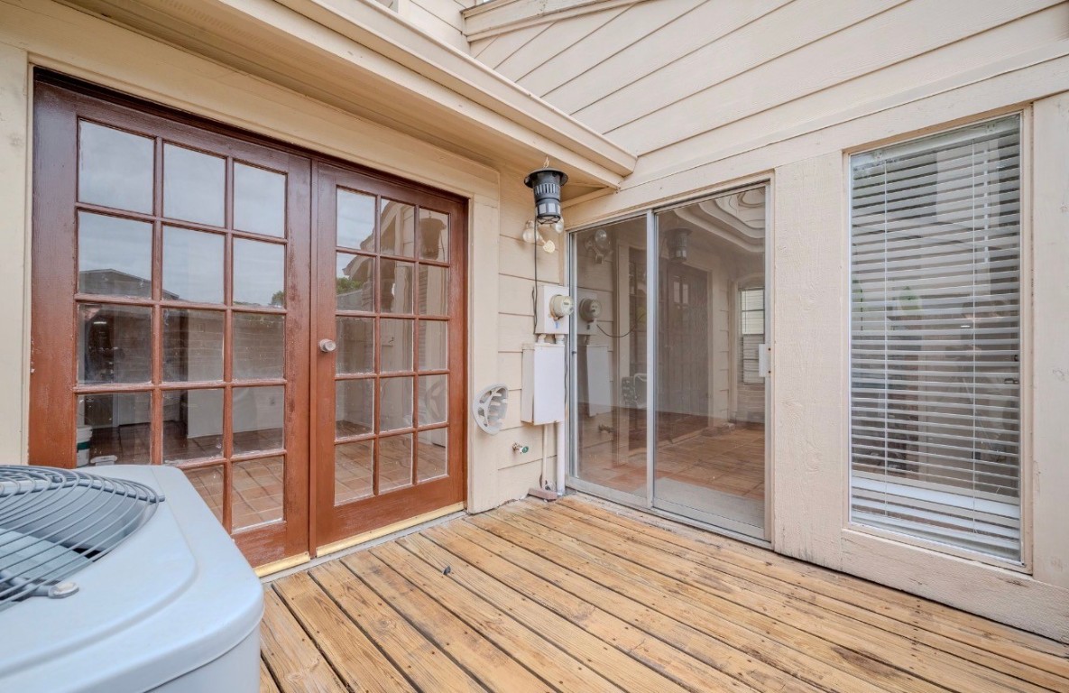 13034 Leader Street, Unit 960 Houston, TX 77072 - Photo 27 of 28 a view of empty room with wooden floor and windows