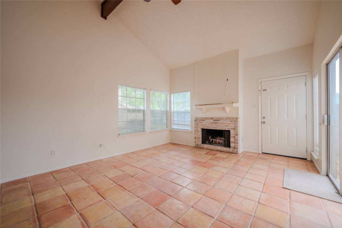 13034 Leader Street, Unit 960 Houston, TX 77072 - Photo 7 of 28 a view of a livingroom with a fireplace and window