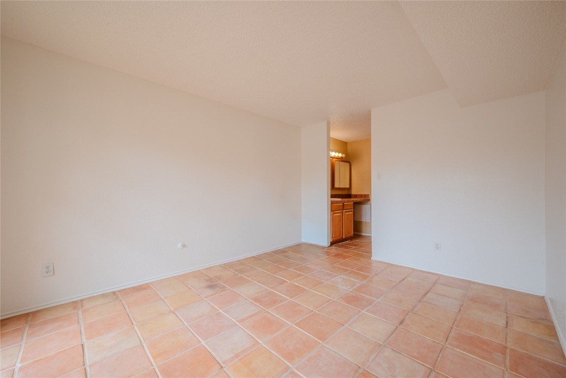 13034 Leader Street, Unit 960 Houston, TX 77072 - Photo 8 of 28 a view of an empty room with wooden floor