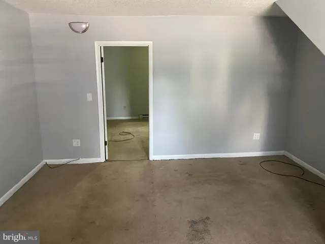 an empty room with an empty space and a window