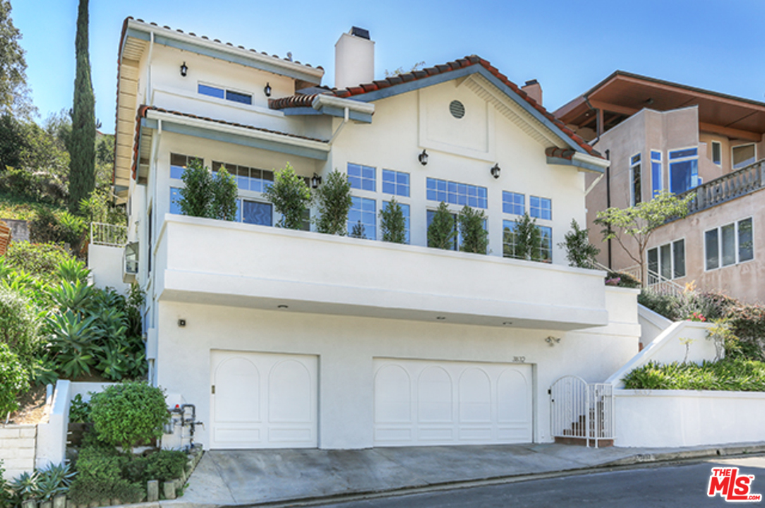 3832 Shannon Road Los Angeles, CA 90027 - Photo 1 of 1 a view of a white building among the street