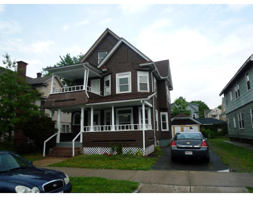 43 Colonial Avenue Springfield, MA 01109 - Photo 1 of 1 a car parked in front of a white house