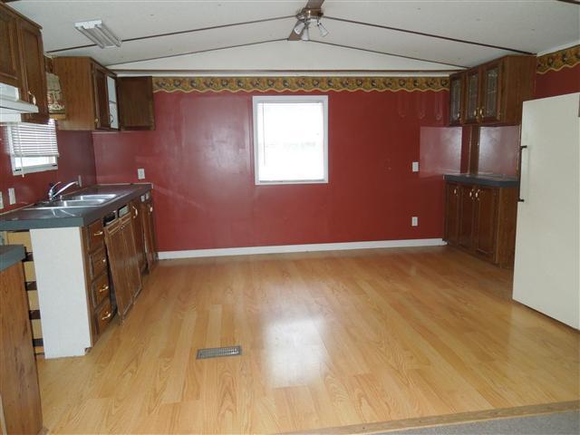 681 Edenway Road Dover, TN 37058 - Photo 12 of 20 Eat in kitchen, laminate floor, refrigerator.