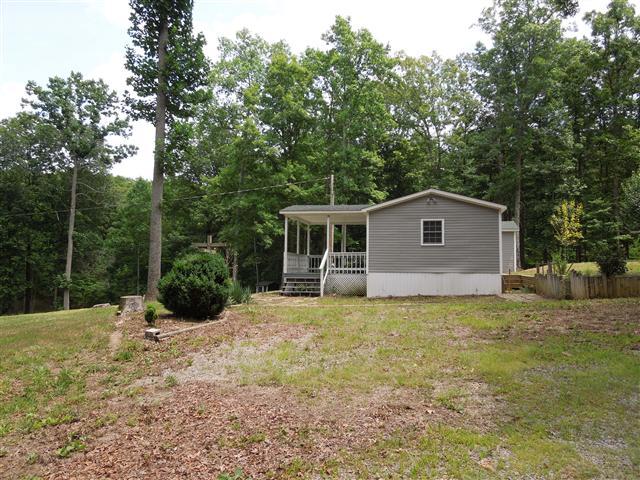 681 Edenway Road Dover, TN 37058 - Photo 2 of 20 Vinyl siding, newer 30 year roof, front covered porch.
