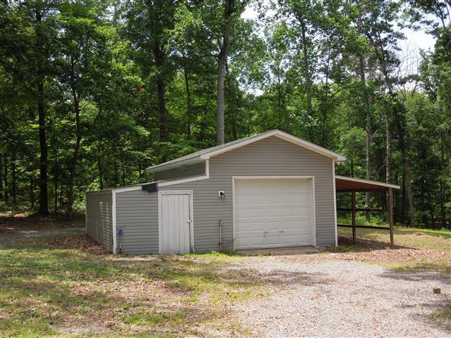 681 Edenway Road Dover, TN 37058 - Photo 7 of 20 Nice detached garage with add on & covered storage to the other side.