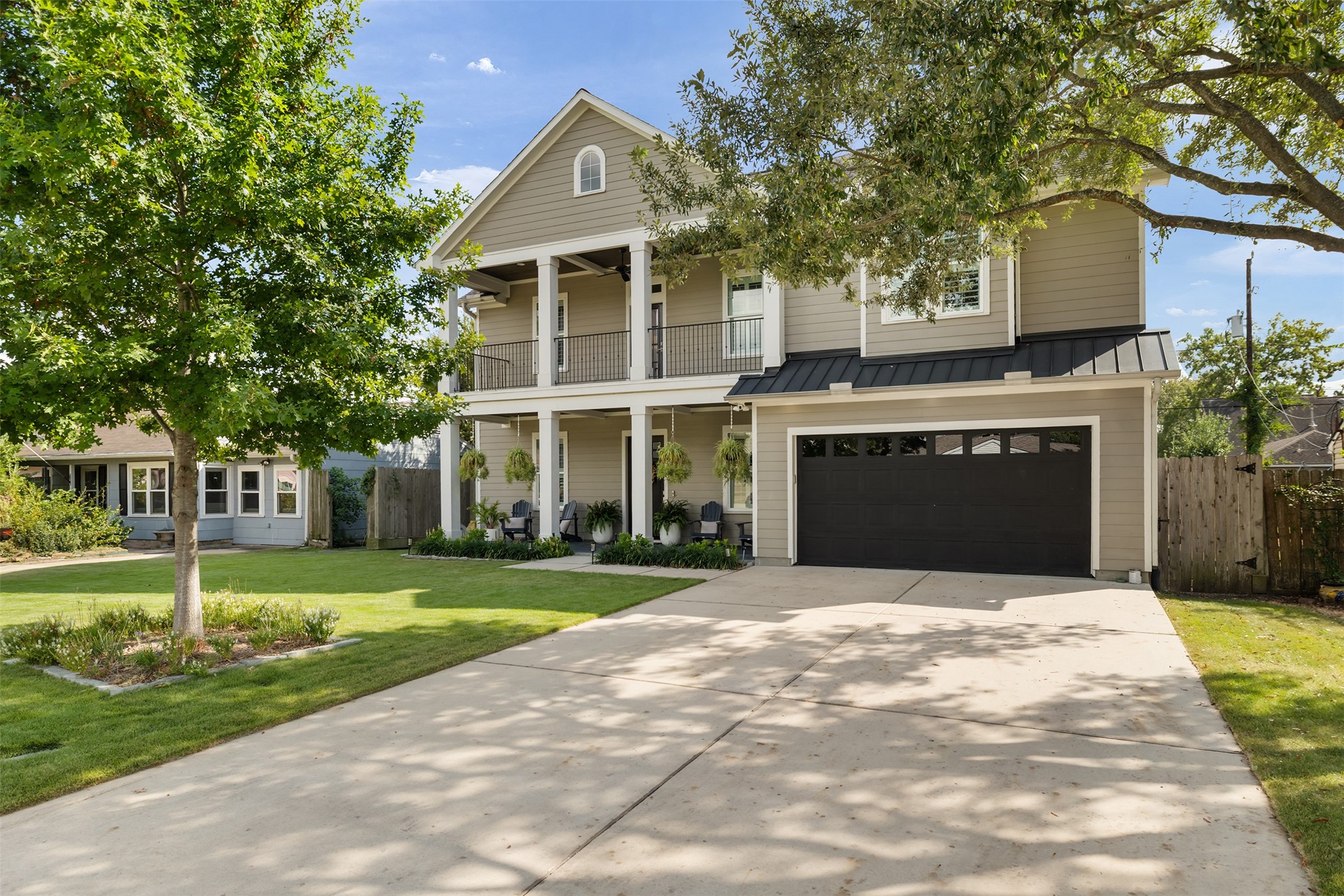 Welcome to elegance! This stunning home boasts fantastic curb appeal with its classic Southern charm and inviting front porch. Truly a grand entrance!