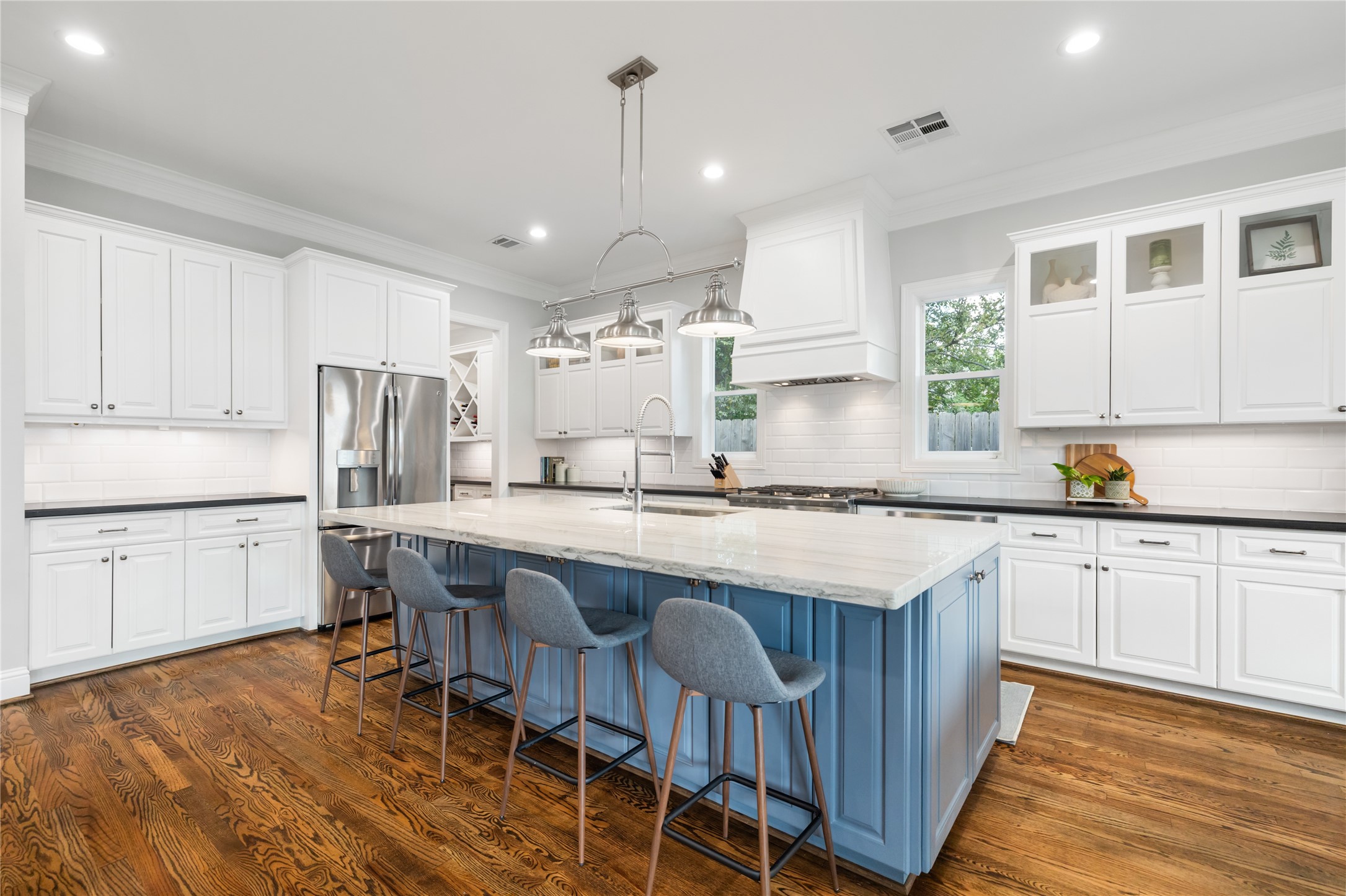 1705 Chippendale Road Houston, TX 77018 - Photo 12 of 50 Get ready to cook! This gourmet kitchen is a dream with its custom cabinetry, high-end appliances, and a huge island for prep and casual dining.