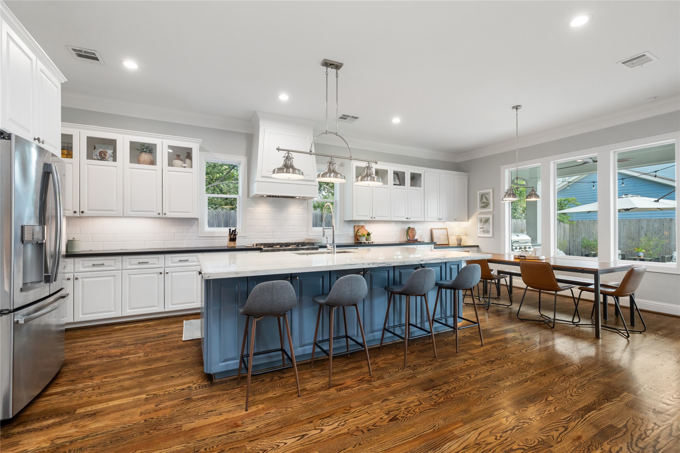 1705 Chippendale Road Houston, TX 77018 - Photo 13 of 50 A wider shot of the impressive kitchen, highlighting the ample counter space and the incredible attention to detail in its design.