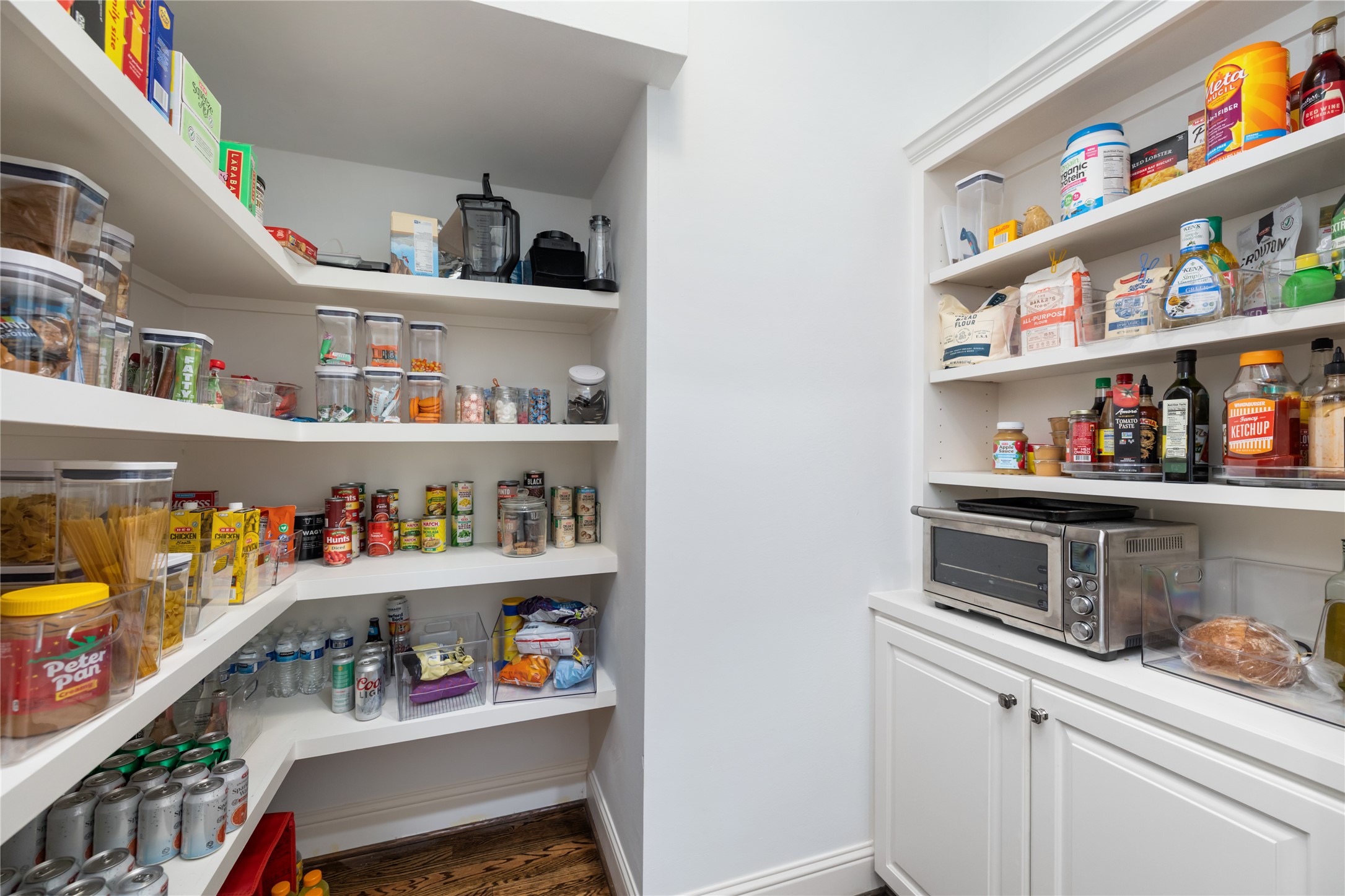 1705 Chippendale Road Houston, TX 77018 - Photo 16 of 50 Unbelievable storage! This walk-in pantry offers custom shelving, ensuring all your kitchen essentials are organized and easily accessible.