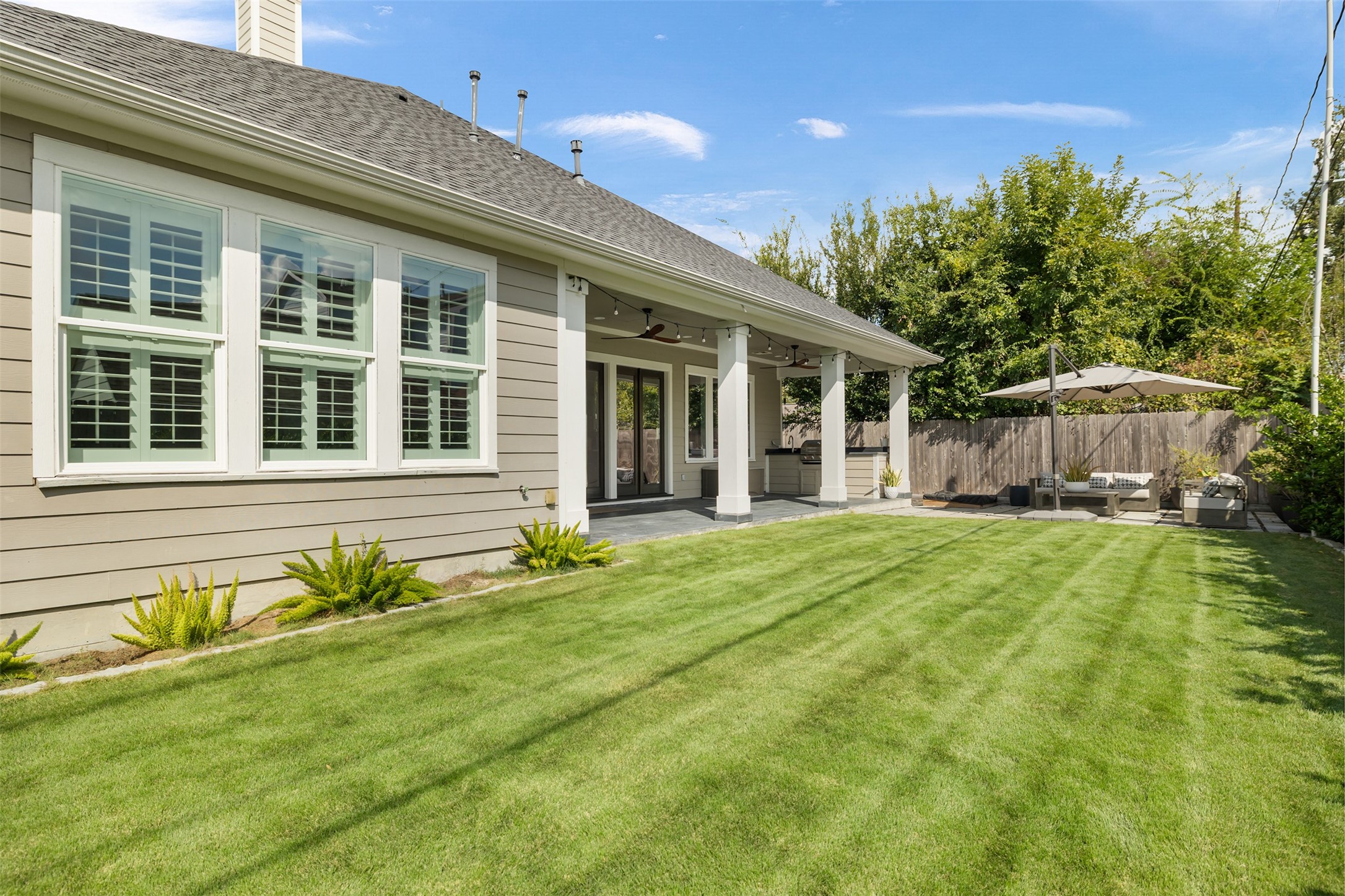 1705 Chippendale Road Houston, TX 77018 - Photo 37 of 50 The lush, green backyard offers plenty of space for play and gardening, providing a private oasis.