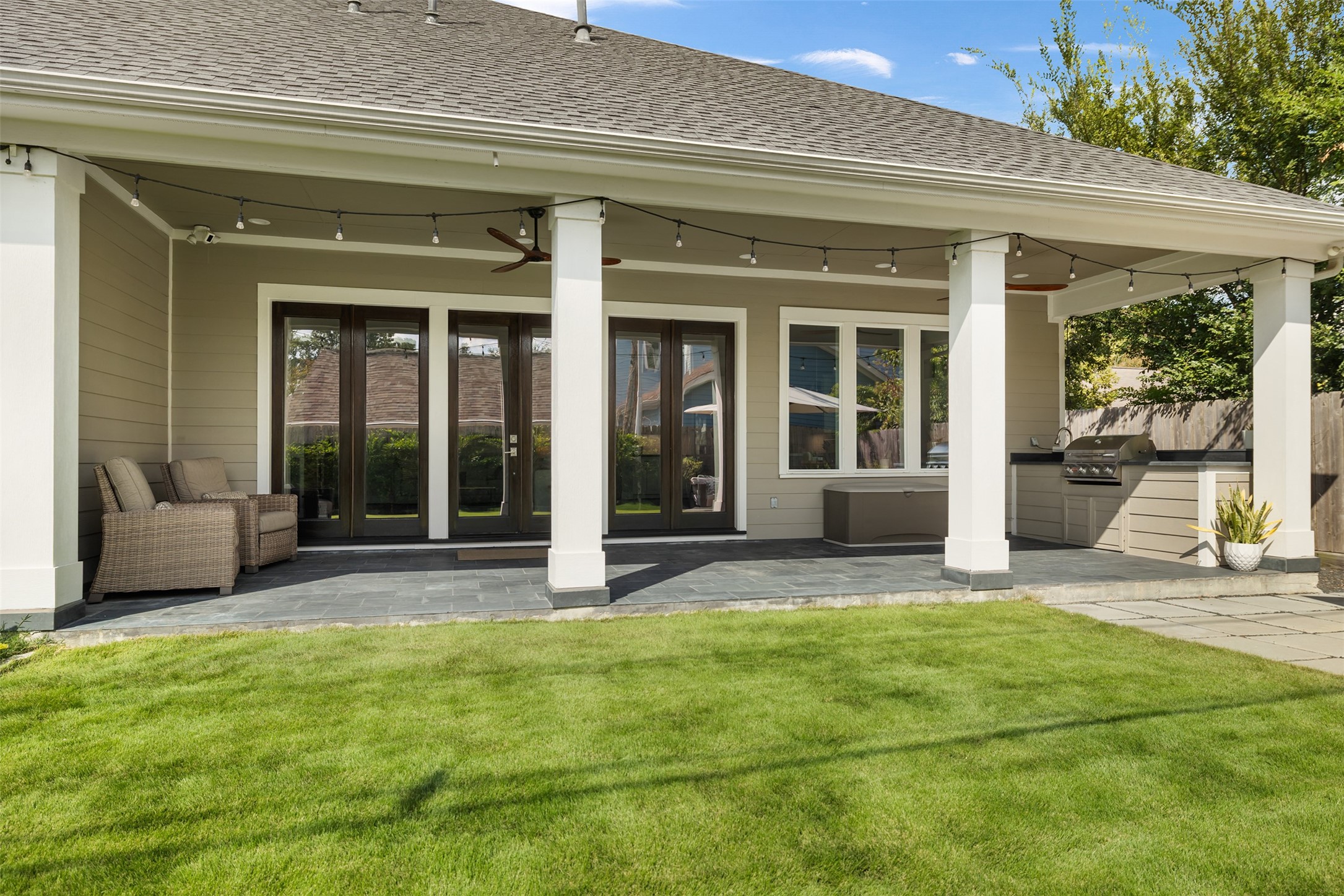 1705 Chippendale Road Houston, TX 77018 - Photo 38 of 50 A great overview of the backyard, highlighting its generous size and the well-maintained lawn.
