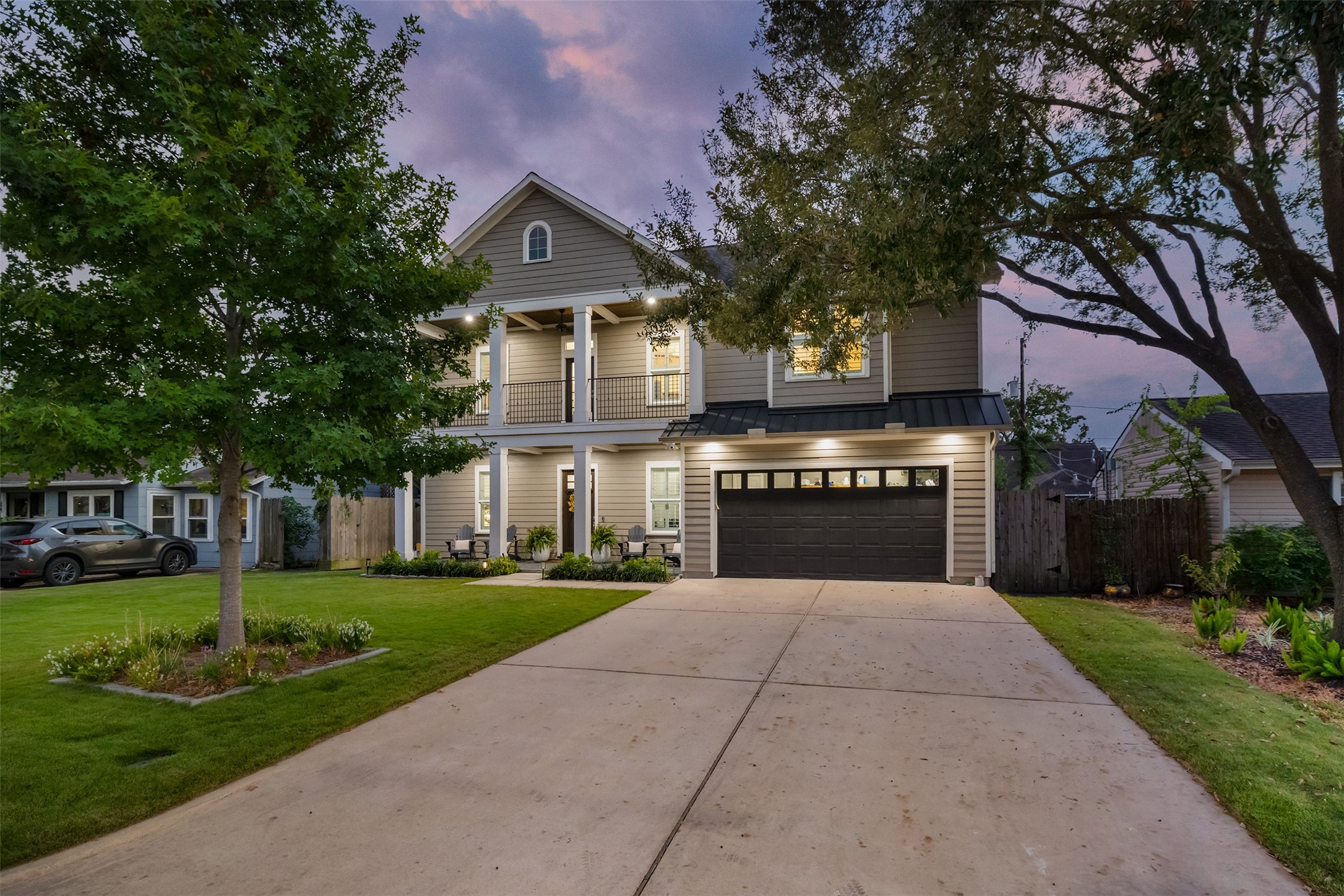 1705 Chippendale Road Houston, TX 77018 - Photo 41 of 50 Absolutely stunning at twilight! The exterior lighting beautifully highlights the home's features, creating incredible evening curb appeal.