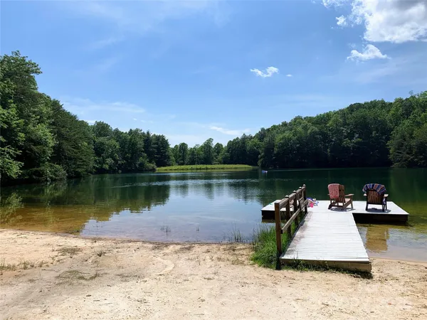 a view of a lake with a car parked