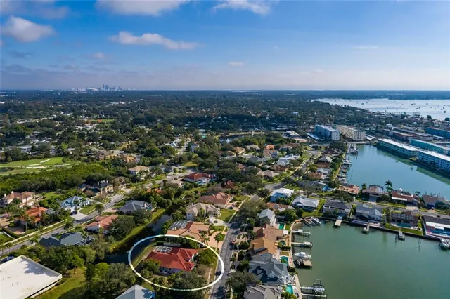 an aerial view of a house with a swimming pool yard and outdoor seating