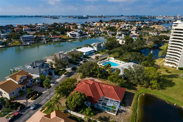 an aerial view of a house with a lake view