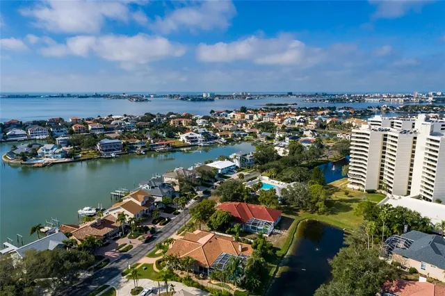 an aerial view of a house with a lake view