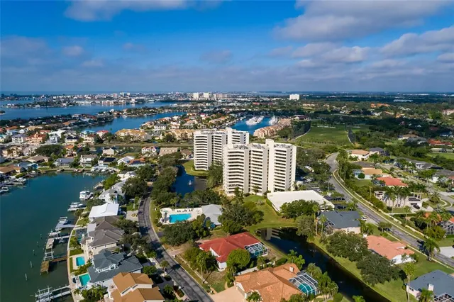 an aerial view of a houses with ocean view