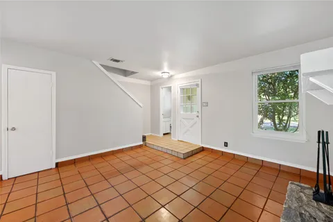 a view of an empty room and window