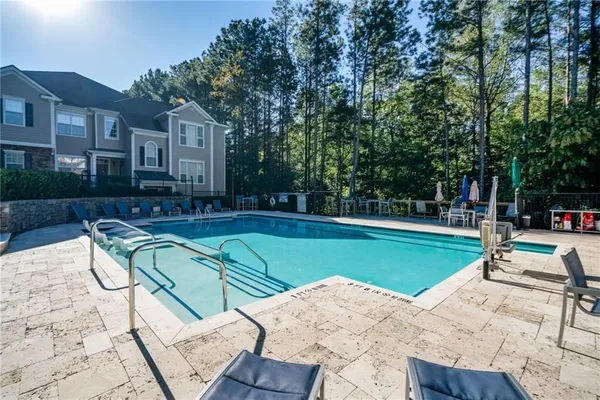 a view of a swimming pool with a patio
