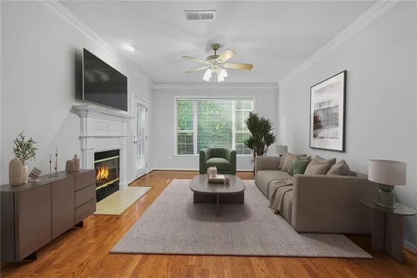 a living room with furniture a fireplace and a flat screen tv