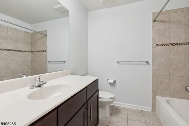 a bathroom with a sink toilet and vanity