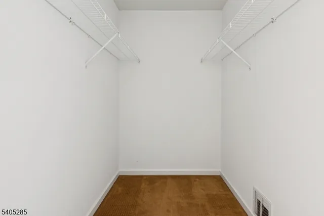 a view of room with racks on the wall