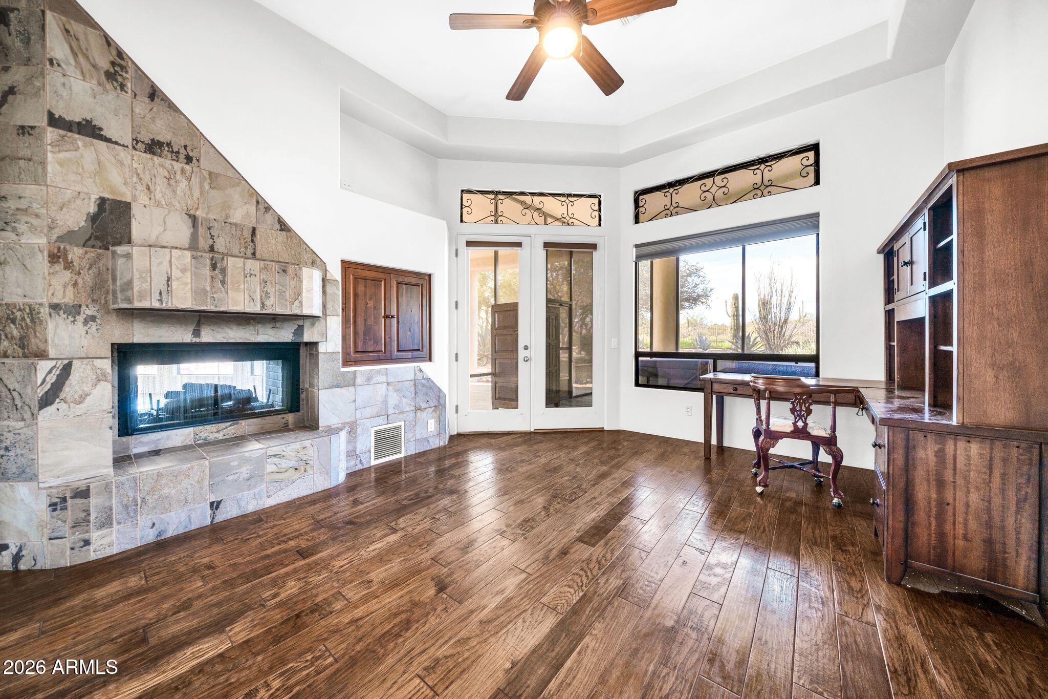 27902 North Agua Verde Drive Rio Verde, AZ 85263 - Photo 23 of 62 a living room with furniture and a fireplace