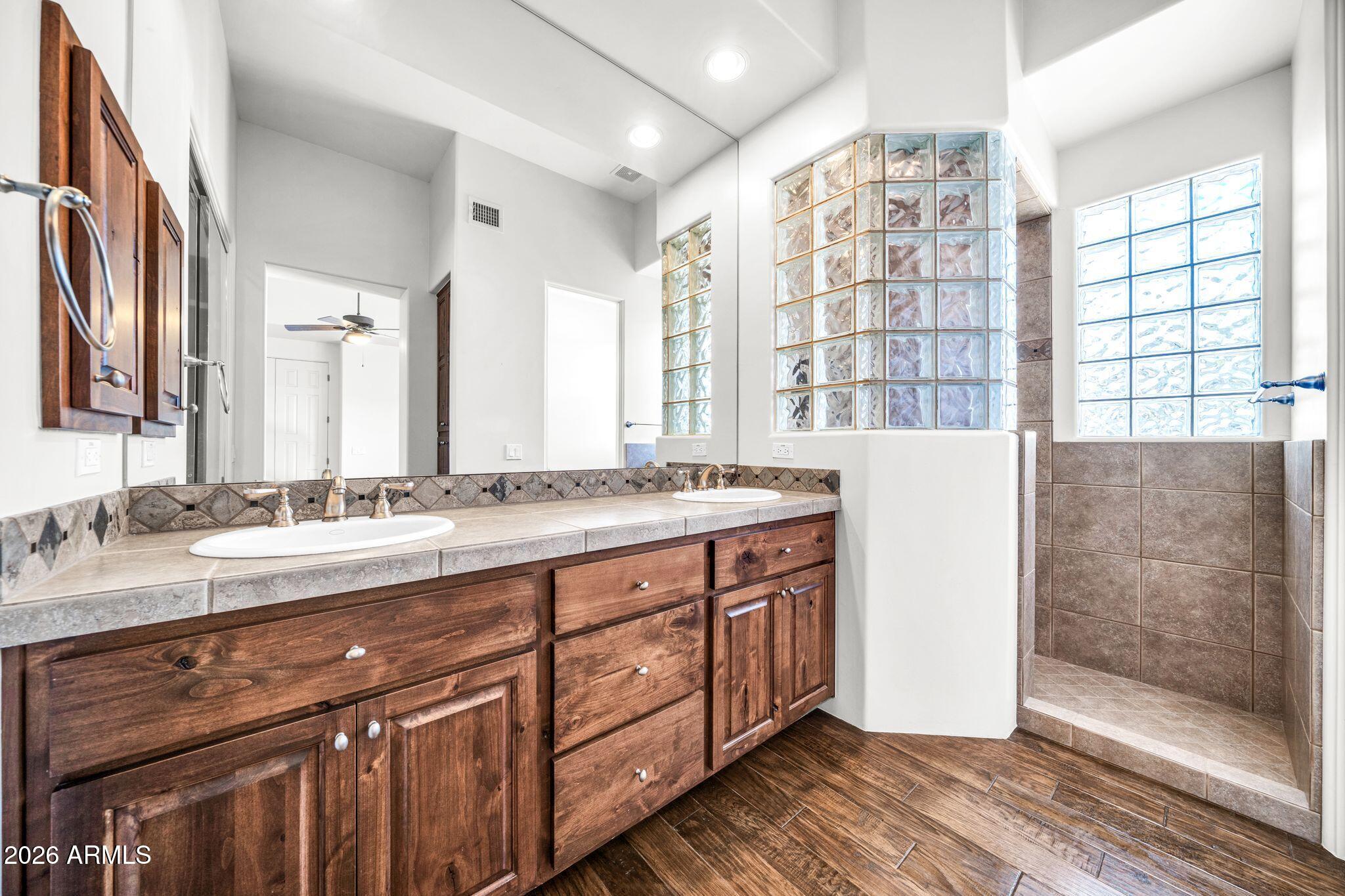 27902 North Agua Verde Drive Rio Verde, AZ 85263 - Photo 43 of 62 a spacious bathroom with double vanity and a mirror