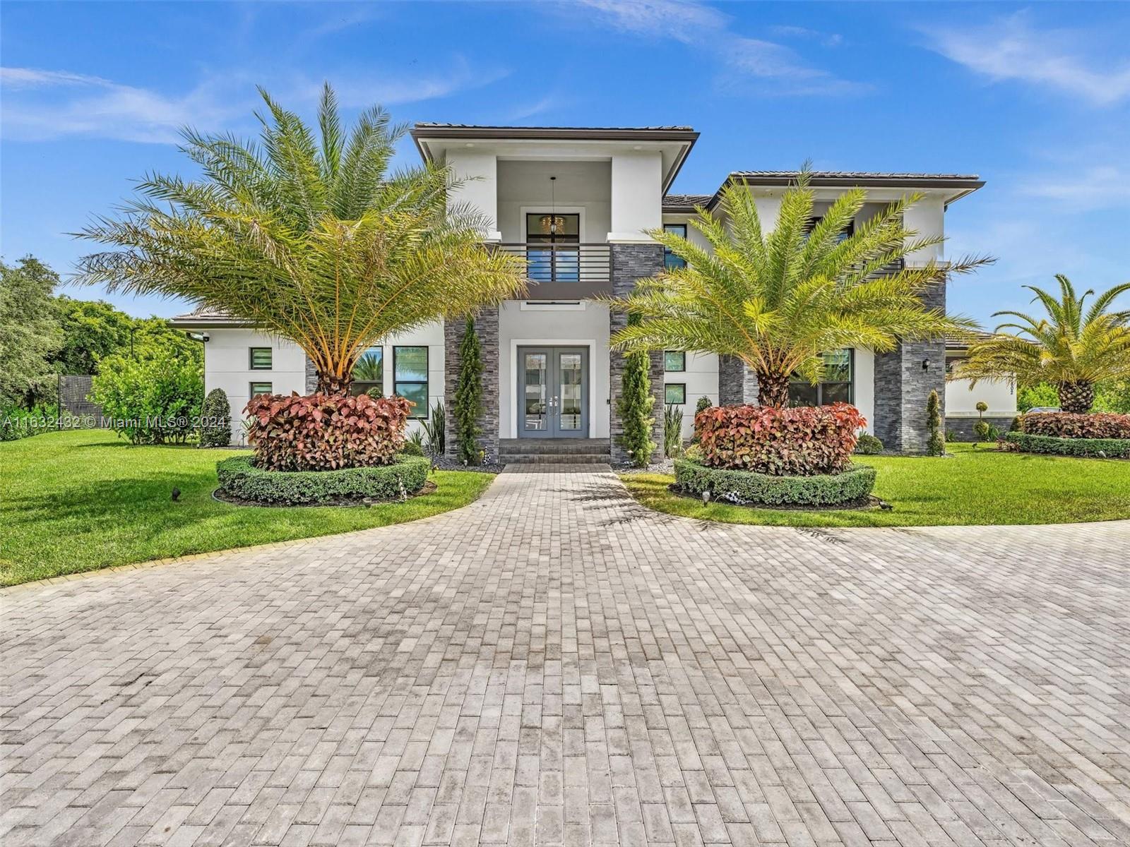 17802 Southwest 58th Street Southwest Ranches, FL 33331 - Photo 2 of 62 a view of a house with a garden