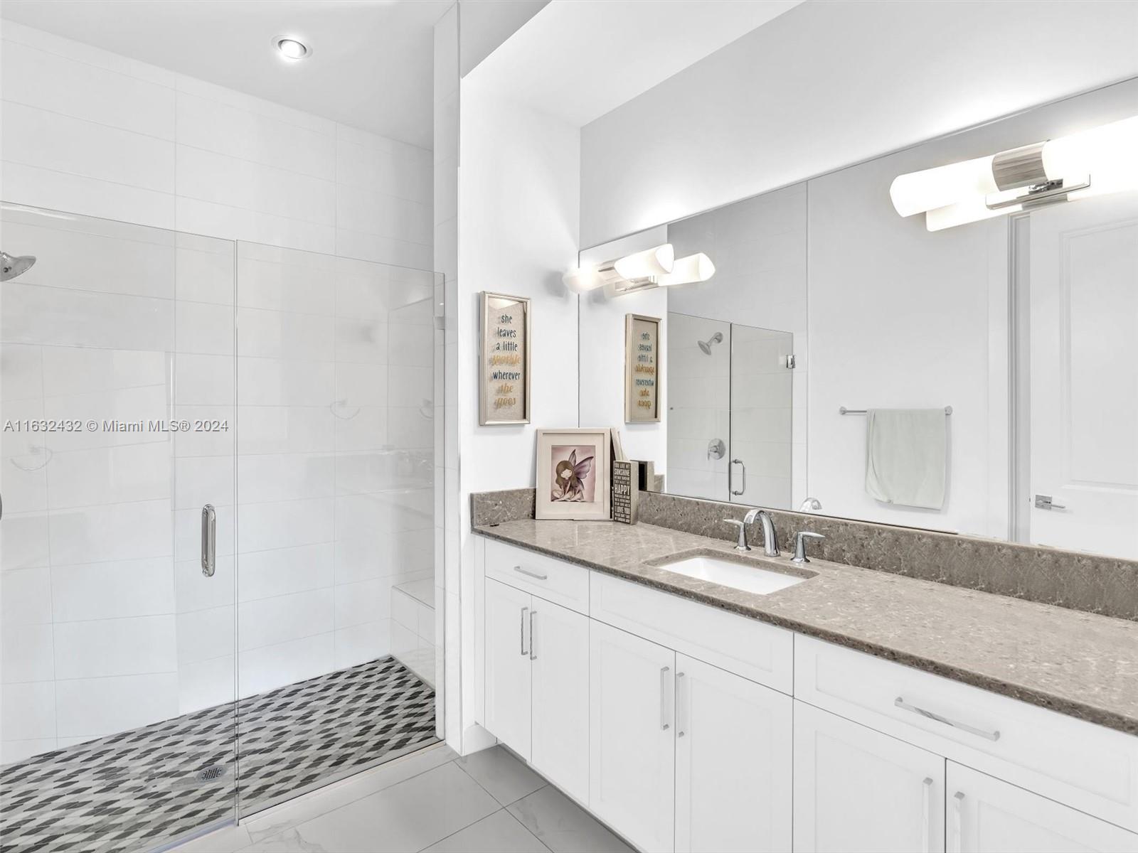 17802 Southwest 58th Street Southwest Ranches, FL 33331 - Photo 29 of 62 a bathroom with a sink and a mirror