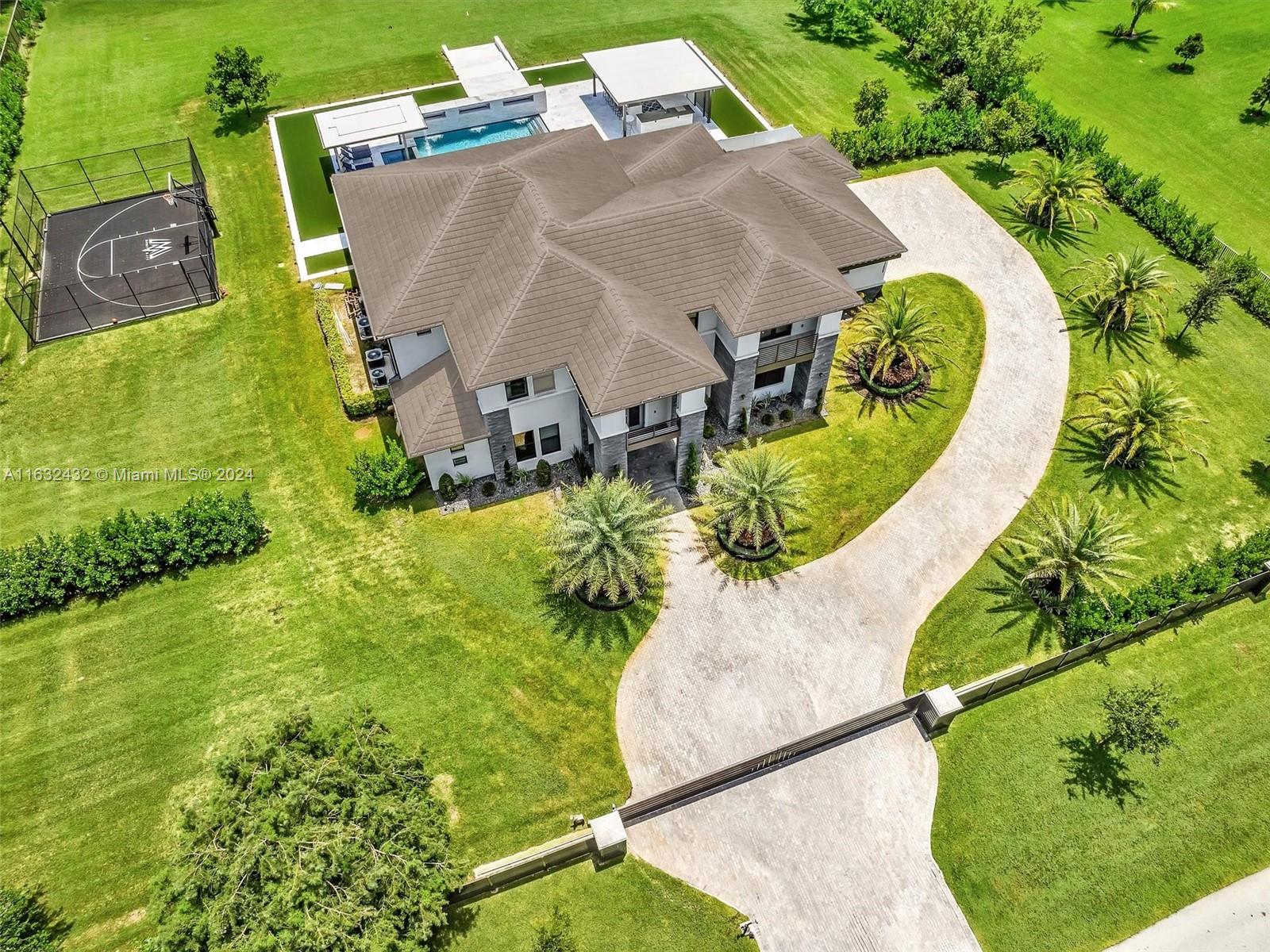 17802 Southwest 58th Street Southwest Ranches, FL 33331 - Photo 54 of 62 an aerial view of a swimming pool