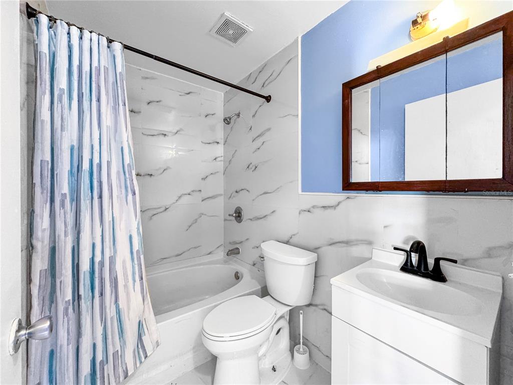 517 3rd Court Southwest Fort Meade, FL 33841 - Photo 17 of 20 a bathroom with a sink toilet and shower