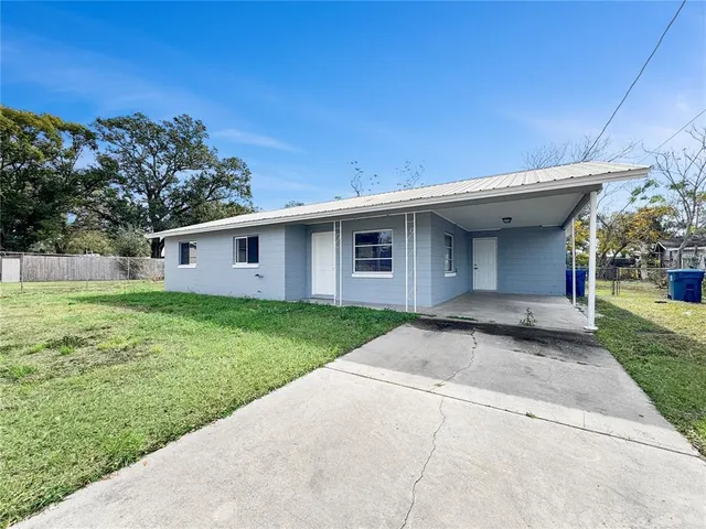 a house with swimming pool in front of it