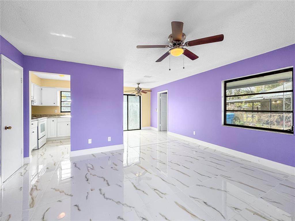 517 3rd Court Southwest Fort Meade, FL 33841 - Photo 7 of 20 a view of a livingroom with a ceiling fan and window