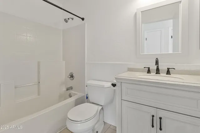 a bathroom with a sink a toilet and a bathtub